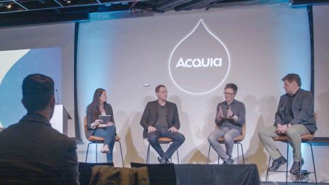 Speakers at an Acquia engage event presenting on stage